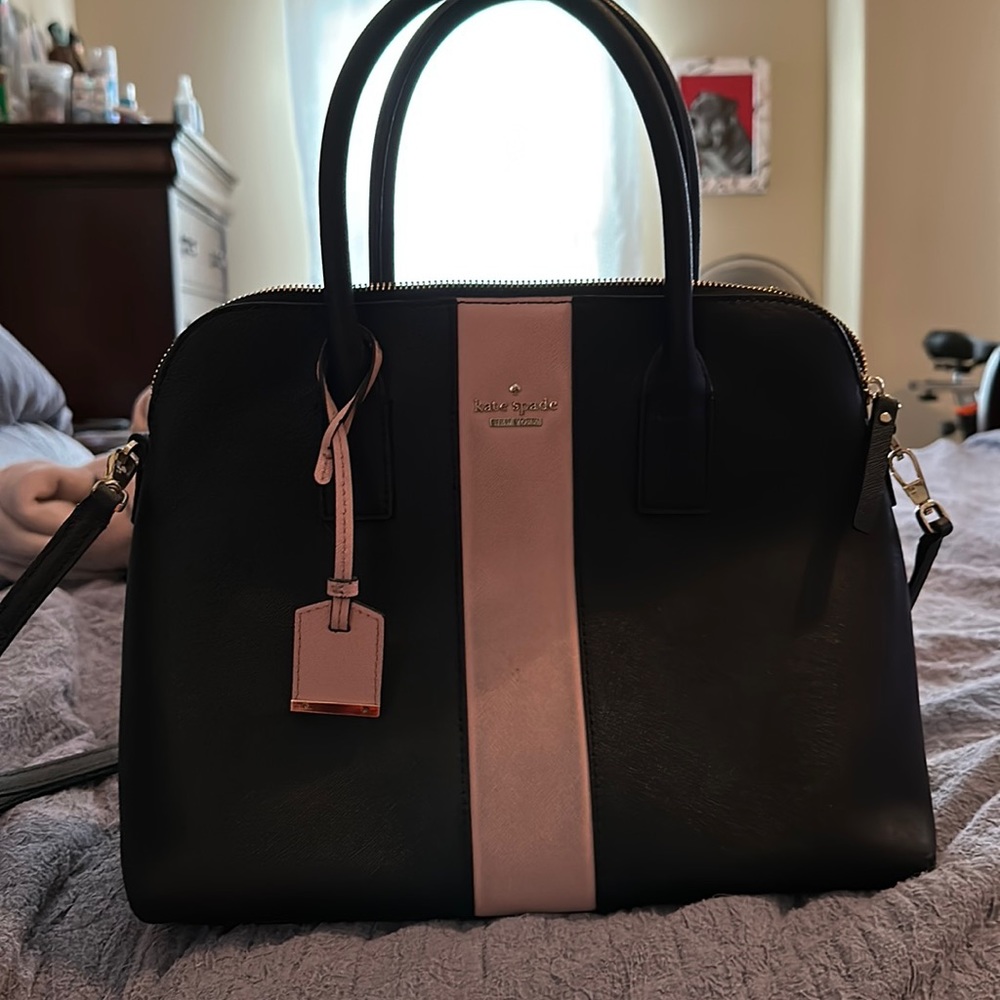 Kate spade black with pink strip.